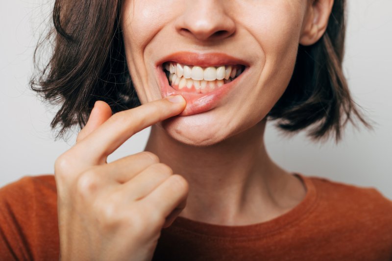Woman shows teeth